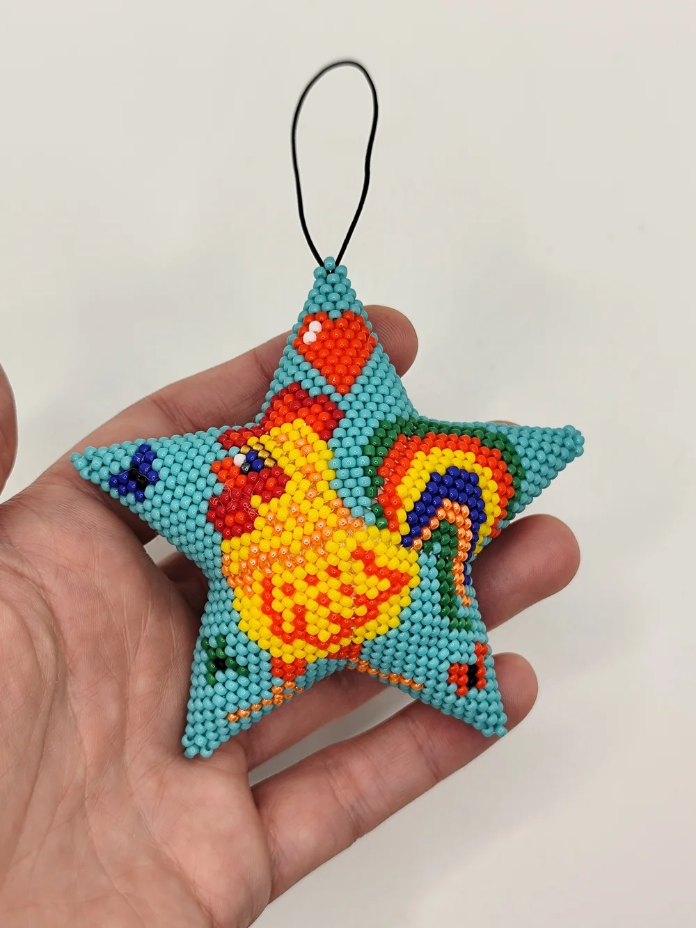 Handcrafted Turquoise Star Bird Ornament with Gold Chicken Design
